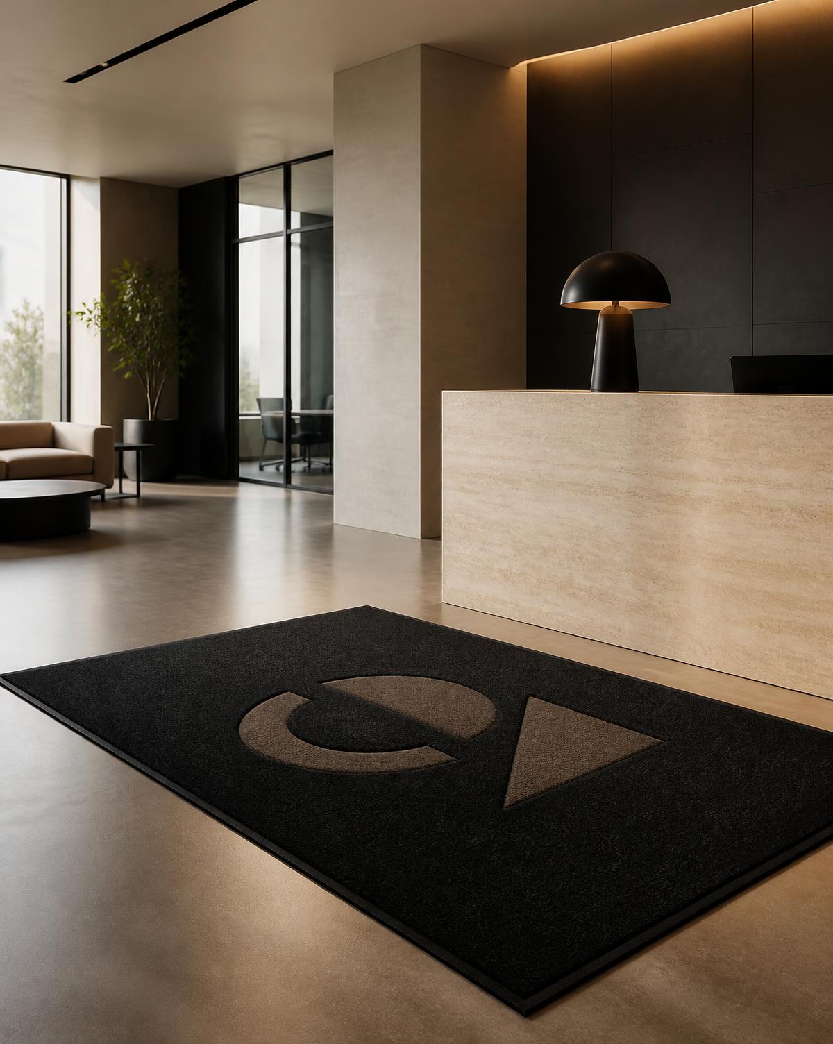 Zerbino personalizzato con logo aziendale nella reception di un ufficio premium